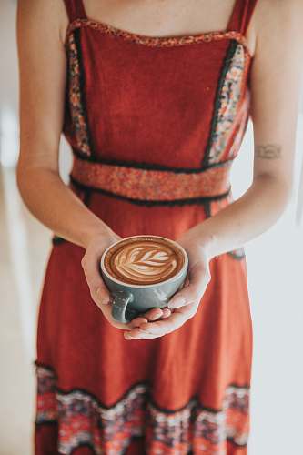 coffee woman carrying coffee latte with art manhattan beach